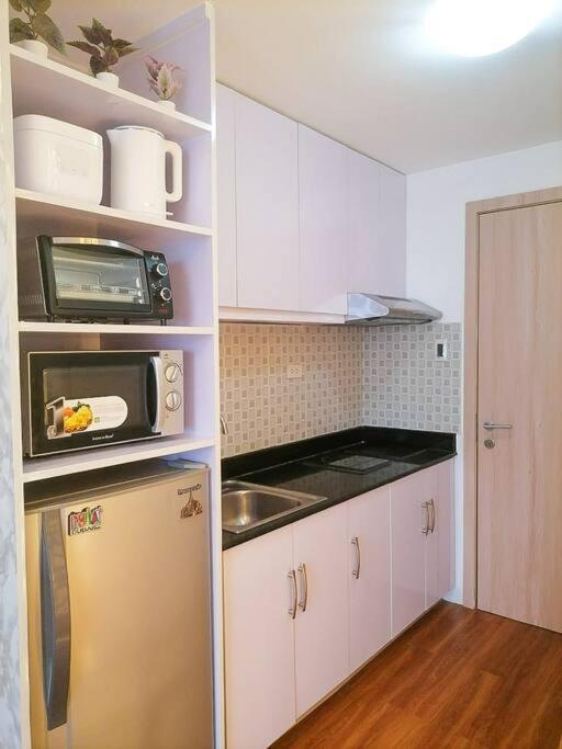 Cozy Studio Unit At Sun Residences Quezon City Buitenkant foto